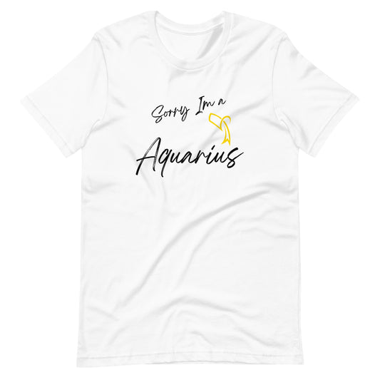 "White t-shirt with 'Sorry I'm a Aquarius' text and Aquarius zodiac symbol in pastel yellow and black design."